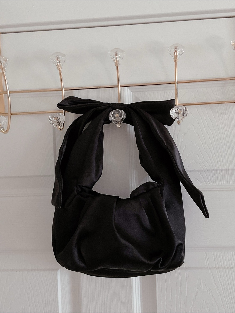 Black bow satin clutch bag